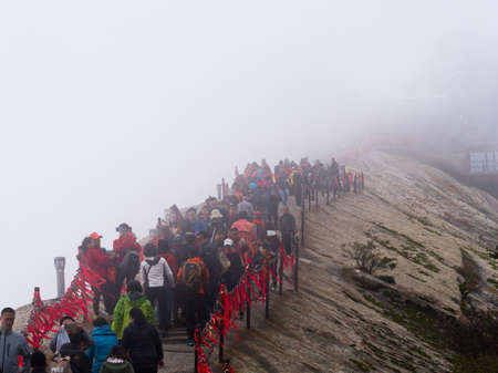 Huashan Mountain near Xian City. The Most dangerous Trail and Crowned People in China. Mount Hua is one of the Five Great Mountains of China in Huayin City, Shaanxi Province, China, 18th October 2018.のeditorial素材