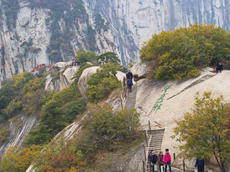Huashan Mountain near Xian City. The Most dangerous Trail and Crowned People in China. Mount Hua is one of the Five Great Mountains of China in Huayin City, Shaanxi Province, China, 18th October 2018.のeditorial素材