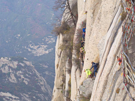 Huashan Mountain near Xian City. The Most dangerous Trail and Crowned People in China. Mount Hua is one of the Five Great Mountains of China in Huayin City, Shaanxi Province, China, 18th October 2018.のeditorial素材