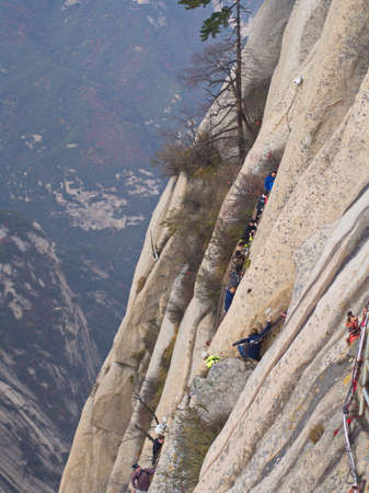 Huashan Mountain near Xian City. The Most dangerous Trail and Crowned People in China. Mount Hua is one of the Five Great Mountains of China in Huayin City, Shaanxi Province, China, 18th October 2018.のeditorial素材