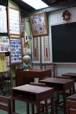 The Wooden Vintage Thai school desk and chairs. Old Time Study Room. Retro House, Bangkok, Thailand. 2020 December 18.のeditorial素材