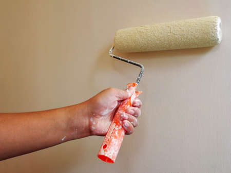 Old grunge concrete wall with removed white acrylic paint.Painting Preparation at homeの写真素材