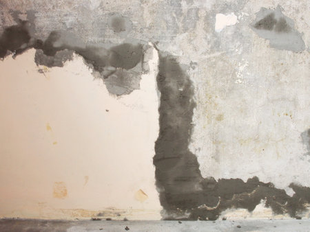 Repaired the old grunge wall with cement powder for building house. Wall Painting Preparation at homeの写真素材