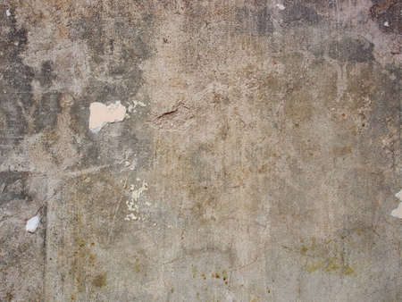 Old grunge concrete wall with removed white acrylic paint.Painting Preparation at homeの写真素材