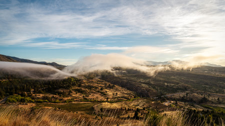 Sunrise and Morning Mist in Esquel Argentinaの写真素材