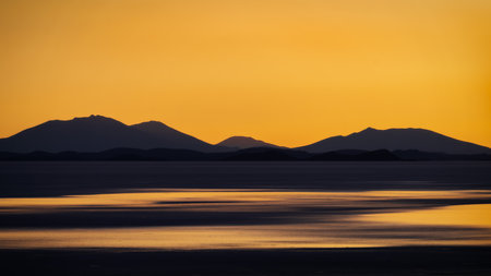 Orange Sunset over Uyuni Salt Lake Boliviaの写真素材