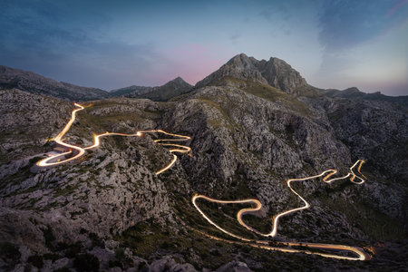 Mountain Road at Night with Light Trails