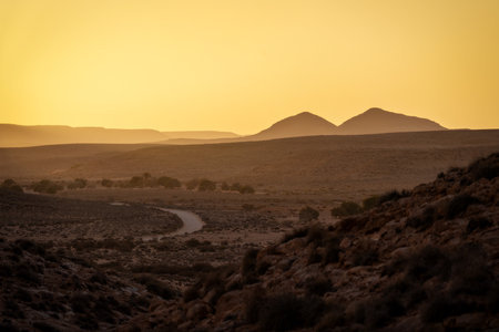 Sahara desert sunset and road in Tunisiaの写真素材