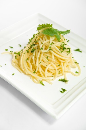 Italian food Bolognese Pasta  Spaghetti meal with basil leaves on a plate isolated on white backgroundの写真素材