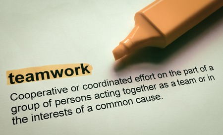 Definition of teamwork, highlighted in colourの写真素材