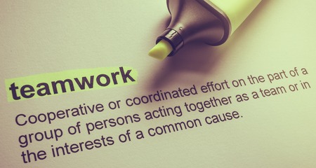 Definition of teamwork, highlighted in colourの写真素材