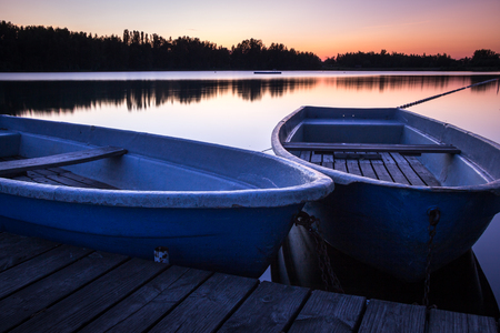 Reservoir at twilight with two boats in the foreground - Saxony, Germanyの写真素材