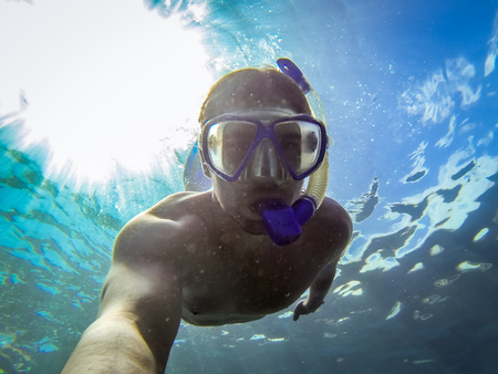 Young man snorkeling in the ocean - Canary Islands, Spainの写真素材