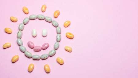 Laughing sun, formed by assorted multicolored jelly beansの写真素材