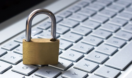 Padlock on a laptop keyboardの写真素材