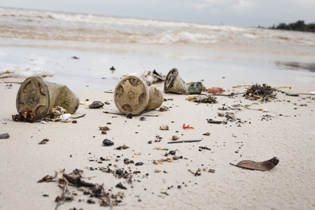 Enviromental pollution - garbage on a beach.の写真素材