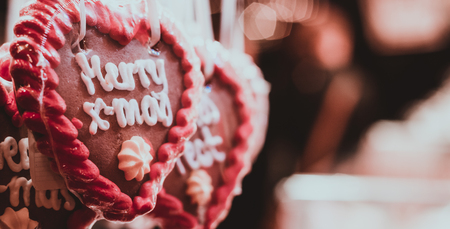 Heart shaped gingerbread "Merry x-mas" at christmas market.の写真素材
