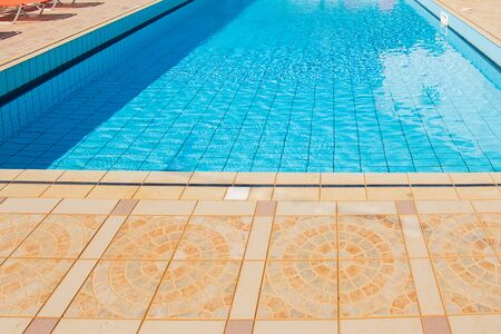 Swimming pool with nobody. vacation resort Outside empty pool with blue water. Outdoor pool property...