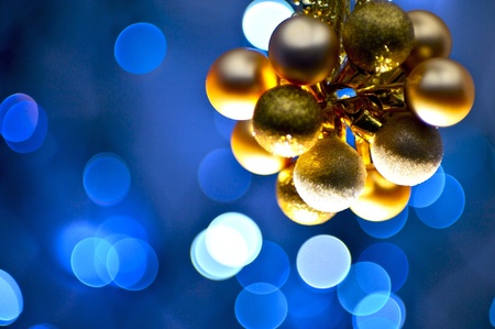 Golden Christmas Ornaments - Blue Light Bokeh Background. Christmas Photo Collection.