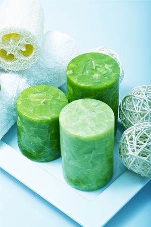 Green Candles on Square Stand and Some Deco Elements. Vertical Photo.の写真素材