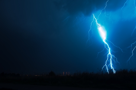 Lightning Storm. Powerful Lightning Bolt on Dark NIght Sky. Electric Storms Photo Collection.