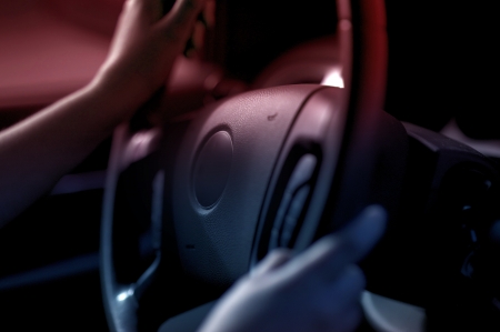 Driving Wheel and Female Hands on it  Female Driver  Wheel Closeup - Transportation Theme のeditorial素材