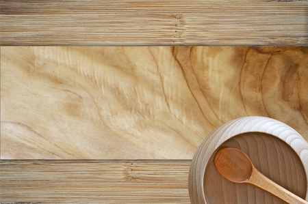Wood Bowl Background. Wood Background with Wood Bowl and Spoon - top View. Raw Wood Kitchen Equipment. Organic Cooking Themeの写真素材