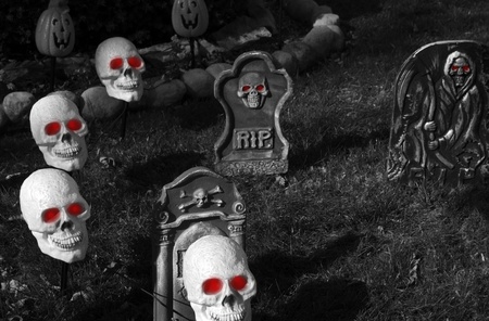 Halloween Graveyard. Halloween Darkness. Skulls with Red Eyes. Halloween Dark Photo Collectionの写真素材