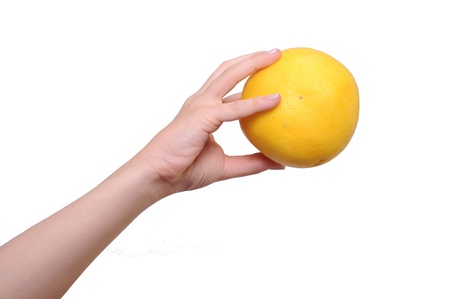 Grapefruit in a Female Hand  Isolated on White の写真素材