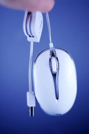 White Wired PC Mouse with USB Cable. Dark Blue Background. の写真素材