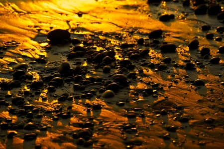 Golden Beach - Black Beach Rocks and Golden Sunset Sand. Nature Photo Background.の写真素材