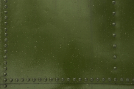 Green Metal with Bolt Heads Photo Background.の写真素材
