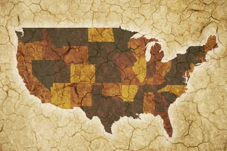 USA Drought Background. Extreme Drought Theme with U.S.A. Map and Cracked Soil Backdrop.の写真素材