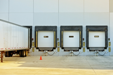 Semi Truck Trailer Warehouse Loading / Unloading. Large Modern American Warehouse Building. Shipping...
