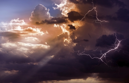 Beautiful Storm During Sunset. Lightnings Between Clouds During Storm. Weather Photo Collection.
