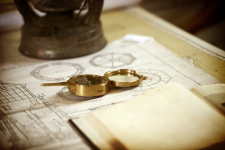 Vintage Scientist Desk - Lighthouse Blueprints and Vintage Compass Closeup. Science and Travel...