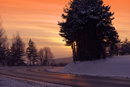Winter Icy Road. Dangerous Winter Curved Road at Sunset. Transportation Collection.の写真素材