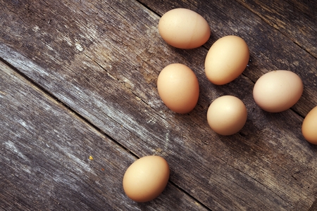Eggs on Wood Table Closeup Photo. Fresh Organic Eggs.