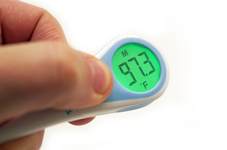 Electronic Thermometer Indicated Right Body Temperature. Electronic Thermometer in Male Hand...