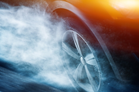 Heavy Rain Driving. Driving Aquaplaning or Hydroplaning Concept. Car Wheel in the Rainstorm. の写真素材