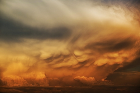 Strange Storm Cell Clouds at Sunset. Cloudscape Photo Backgroundの写真素材