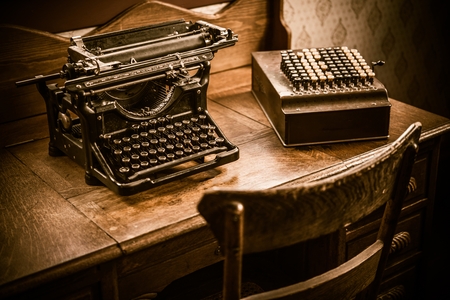 Vintage Accountant Desk with Vintage Typewriter and Vintage Calculating Machine.