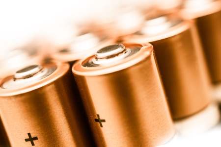 AA Batteries Closeup on a White Background. Batteries Technology. の写真素材