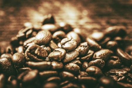 Golden Coffee Beans. Cafe Concept. Coffee Beans Closeup.の写真素材