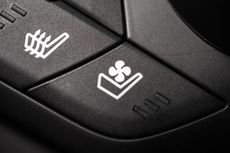 Heated and Ventilated Car Seat Controls. Heat and Ventilation Buttons Closeupの写真素材