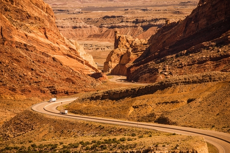 Rocky Desert Utah Highway with Semi Trucks. Scenic Utah Interstate Highway I-70. United States.の写真素材