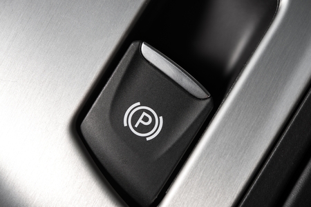 Manual Parking Brake Button in a Modern Car. Button Closeup.の写真素材