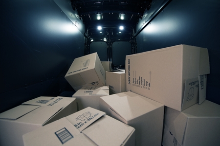 Cardboard Moving Boxes in the Large Commercial Van Cargo Area. の写真素材
