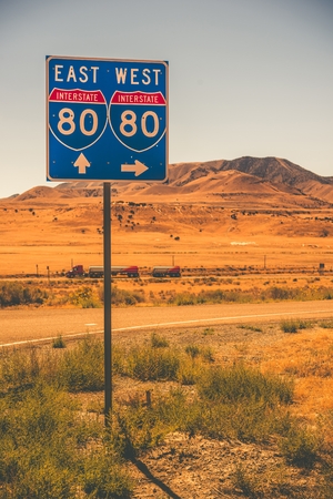 Interstate Entrance Sign and Some Speeding Semi Truck.の写真素材