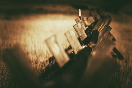 Colorado Mountains Wood Logs Fence and the Meadow. Vintage Brown Color Grading.の写真素材